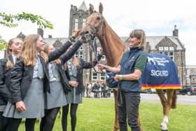 Racehorse Sigurd and trainer Jo Foster (right) meets children from Ilkley Grammar School in Ilkley ahead of National Racehorse Week last year. National Racehorse Week is a celebration of racehorses and the people that care for them, with events taking place at more than 150 venues across Great Britain during September: Richard Walker/PA Wire