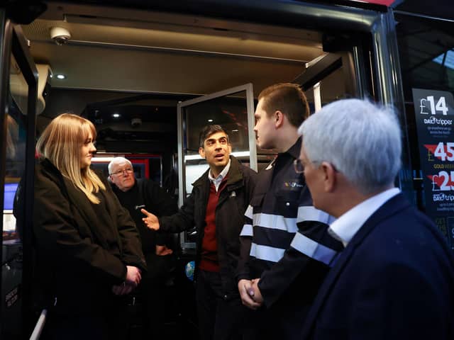 Prime Minister Rishi Sunak (centre) during his visit to a bus depot in Harrogate, North Yorkshire. PIC: Carl Recine/PA Wire