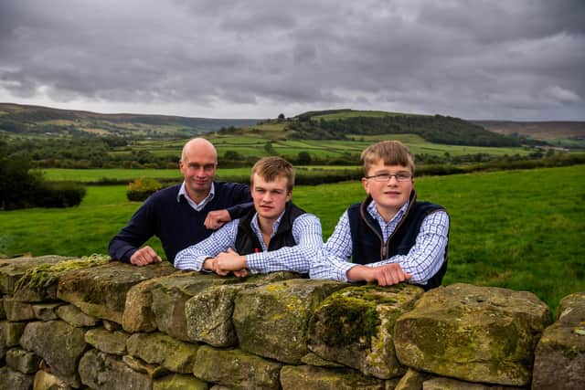 Farmer Tom Thompson, with his sons James and Carl.