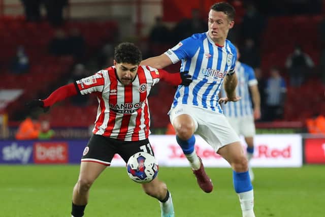 DIFFERENCE-MAKER: Huddersfield Town's Jonathan Hogg tackles Reda Khadra