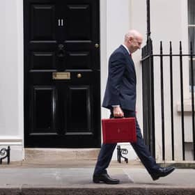 Chancellor John Healey poses for photographs as he leaves 11 Downing Street, London, before delivering his first Budget. 