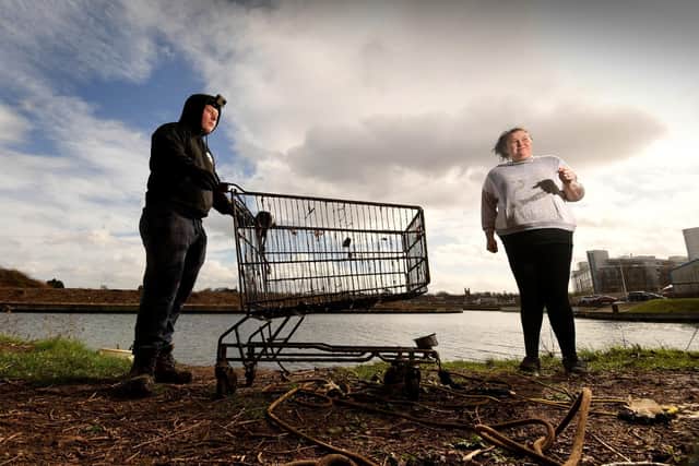 Ricky Mann and Kerry Carter are pictured with a shopping trolley they pulled out of the River Don, in Doncaster, while they were out magnet fishing. Picture taken by Simon Hulme.