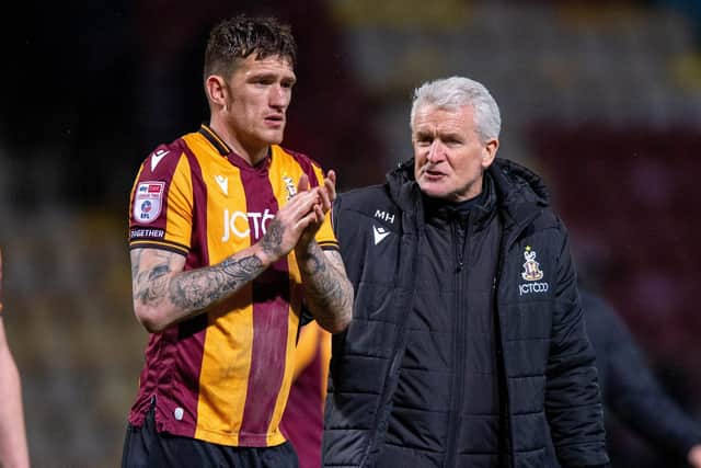 OVER THE LINE: Bradford City manager Mark Hughes with striker Andy Cook, scorer of the game-winning goal against Grimsby Town. Picture: Bruce Rollinson
