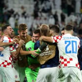 AL RAYYAN, QATAR - DECEMBER 09: Croatia players celebrate their win via a penalty shootout during the FIFA World Cup Qatar 2022 quarter final match between Croatia and Brazil at Education City Stadium on December 09, 2022 in Al Rayyan, Qatar. (Photo by Alex Grimm/Getty Images)