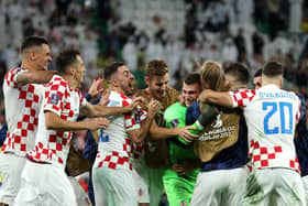 AL RAYYAN, QATAR - DECEMBER 09: Croatia players celebrate their win via a penalty shootout during the FIFA World Cup Qatar 2022 quarter final match between Croatia and Brazil at Education City Stadium on December 09, 2022 in Al Rayyan, Qatar. (Photo by Alex Grimm/Getty Images)