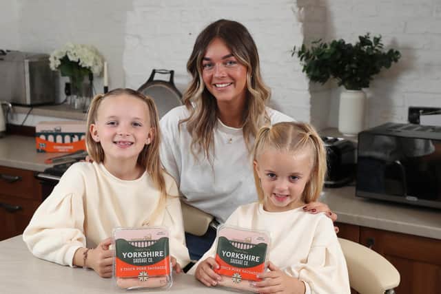 Single mum Elisia Proctor launches a chuffin’ tasty sausage offering great food at a pocket-friendly price. She is pictured with children Nellie and Florence.