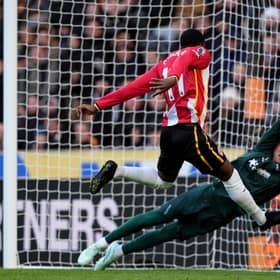 points dropped: Brentford’s Dango Ouattara scores his side’s equaliser, beating Hull City goalkeeper Konstantinos Tzolakis at MKM Stadium. Picture: Mike Egerton/PA.
