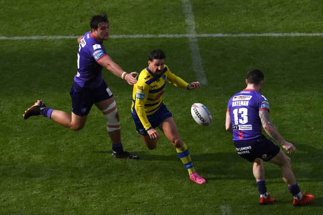 Gareth Widdop makes a break during the Betfred Super League match between Wigan Warriors and Warrington Wolves. (Photo by Stu Forster/Getty Images)