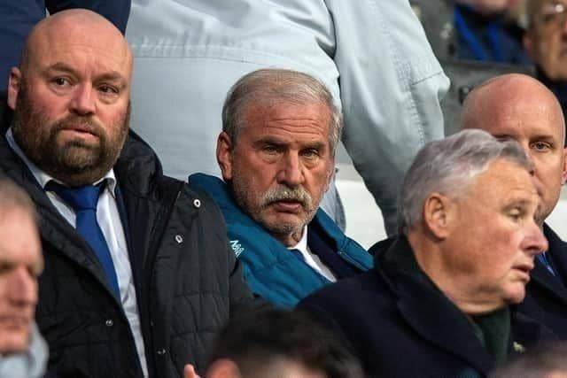 Huddersfield Town chairman and owner Kevin Nagle (centre),flanked by sporting director Mark Cartwright (left) and chief executive officer Jake Edwards (right).
