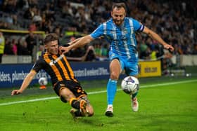 Regan Slater gets the ball past Liam Kelly during Hull City's 1-1 draw with Coventry City. (Picture: Bruce Rollinson)