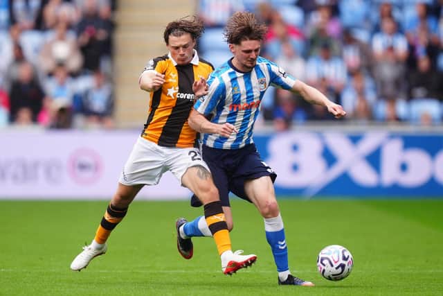 PROBLEM AREA: Regan Slater closes down Jack Rudoni, who caused Hull first-half problems (Image: Press Association)