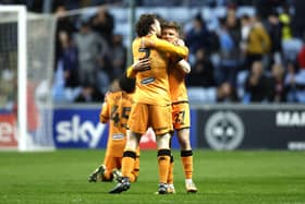 Hull City's Lewis Coyle (left) and Regan Slater celebrate victory following the final whistle in the Sky Bet Championship match at Coventry. Photo: Nigel French/PA Wire.