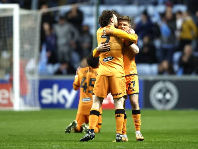 Hull City's Lewis Coyle (left) and Regan Slater celebrate victory following the final whistle in the Sky Bet Championship match at Coventry. Photo: Nigel French/PA Wire.