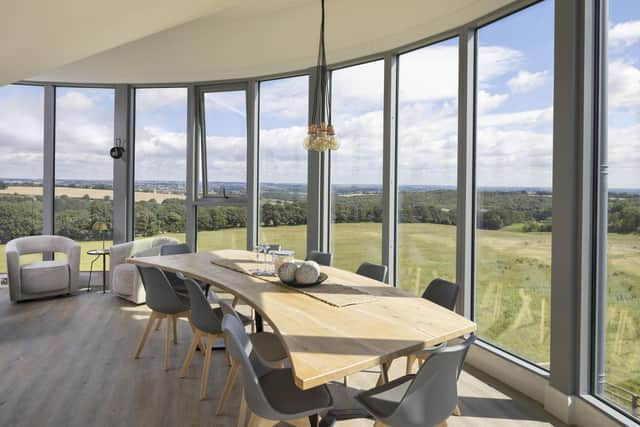 The bespoke curved dining table and those views