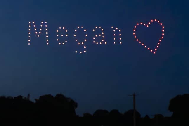 Drones spell out the word "Megan as Rhys Whelan (not pictured) proposes to Megan Greenwood (not pictured), during a surprise proposal at the Fireworks Championships 2023 at Newby Hall, near Ripon.
