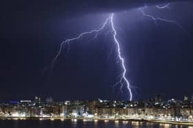 A lightning bolt strikes during a thunderstorm. (Pic credit: Mariana Suarez / AFP via Getty Images)