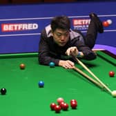 Liang Wenbo of China plays a shot during the Betfred World Snooker Championship. (Photo by George Wood/Getty Images)