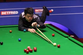 Liang Wenbo of China plays a shot during the Betfred World Snooker Championship. (Photo by George Wood/Getty Images)