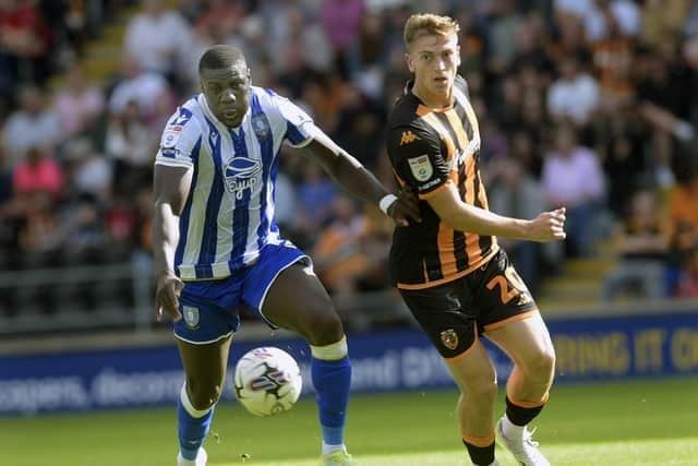 Hull City striker Liam Delap (right), competes for the ball with Sheffield Wednesday rival Bambo Diaby in the Championship fixture in August. Picture: Steve Ellis.