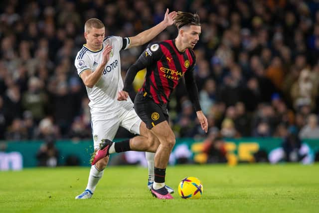 Manchester City's Jack Grealish gets past Leeds United's Rasmus Kristensen. Picture: Bruce Rollinson