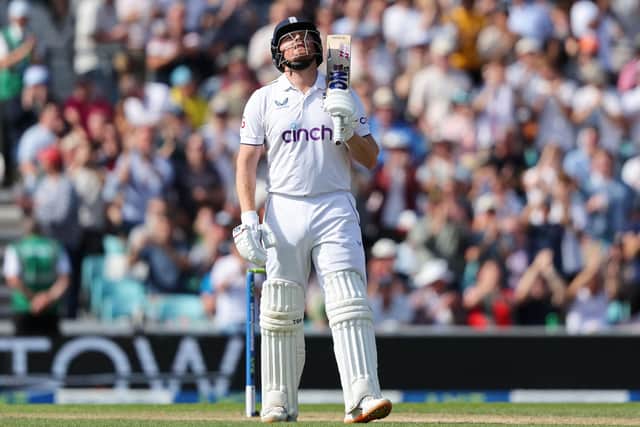 England's Jonny Bairstow celebrates reaching his half century on day three of the fifth Ashes cricket Test (Picture: ADRIAN DENNIS/AFP via Getty Images)