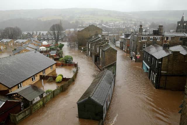 The River Calder bursts its banks in the Calder Valley town of Mytholmroyd on December 26, 2015. Photo by Christopher Furlong/Getty Images.