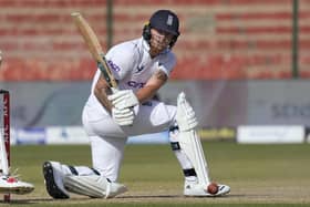 LEADING MAN: England's Ben Stokes guides the ball down to the long leg boundary as he helps his team to victory on the fourth day of the thirdTest match between Pakistan in Karachi.
