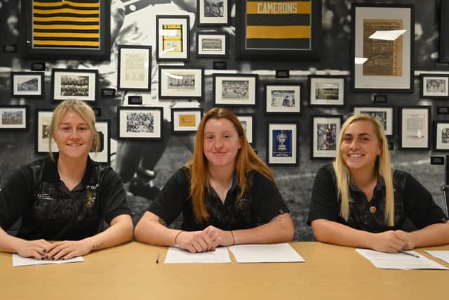 Groundbreaking: Tara Jane Stanley (left), Liv Wood (centre) and Sinead Peach (right) sign professional contracts with York Valkyries (Picture: Sheridan Hunt / York RLFC)