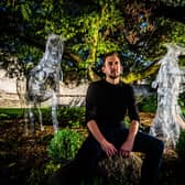 Carl Alsop, Operations Manager at York BID near the ghostly figures positioned around Yorks Museum Gardens. Picture By Yorkshire Post Photographer,  James Hardisty.