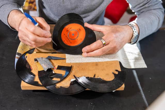 Vinyl artist, Kenny Deane, of Goathland, North Yorkshire, creates visually eye-catching artwork from vinyl records he cuts into shape, then frames. Picture By Yorkshire Post Photographer,  James Hardisty