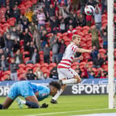 DECISIVE MOMENT: George Miller wheels away scoring his second goal of the game and Doncaster Rovers' third