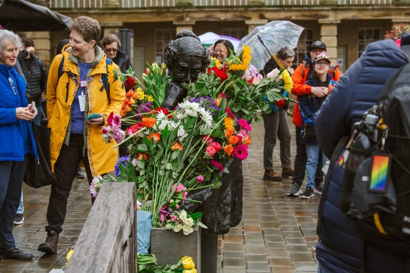 The sculpture of Anne Lister is adorned with flowers. Credit: Ellis Robinson