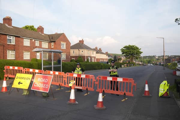 Police officers at the scene in Grimethorpe after more than 100 homes were evacuated in the former pit village after an Army bomb squad was deployed in the wake of a police operation. Picture date: Wednesday May 8, 2024. PA Photo. South Yorkshire Police established a 100-metre cordon around a property in Grimethorpe, Barnsley, on Wednesday morning after "a number of suspicious items" were found as police executed a warrant on Brierley Road. See PA story POLICE Grimethorpe. Photo credit should read: Danny Lawson/PA Wire