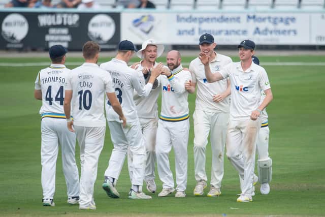 Adam Lyth is congratulated by his team-mates after taking a catch at second slip to remove Brooke Guest off the bowling of Ben Coad on the final day at Scarborough. Picture by Allan McKenzie/SWpix.com