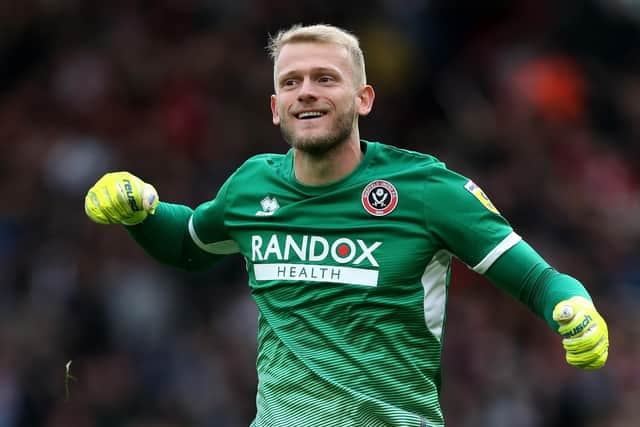 Sheffield United goalkeeper Adam Davies celebrates after team-mate Oli McBurnie scores their side's second goal during the Sky Bet Championship match at Bramall Lane, Sheffield. Picture: Barrington Coombs/PA Wire.