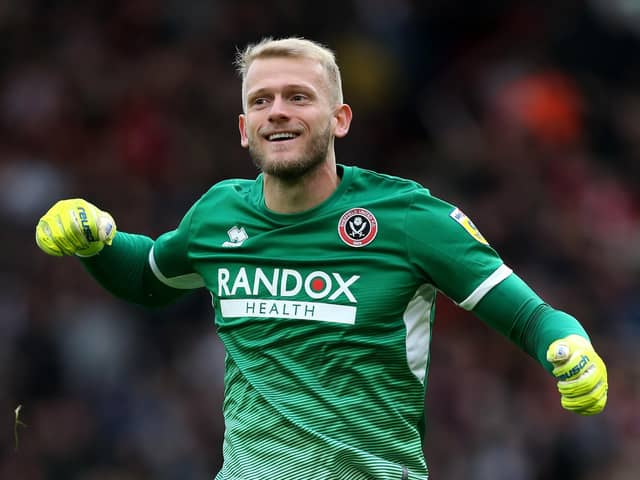 Sheffield United goalkeeper Adam Davies celebrates after team-mate Oli McBurnie scores their side's second goal during the Sky Bet Championship match at Bramall Lane, Sheffield. Picture: Barrington Coombs/PA Wire.