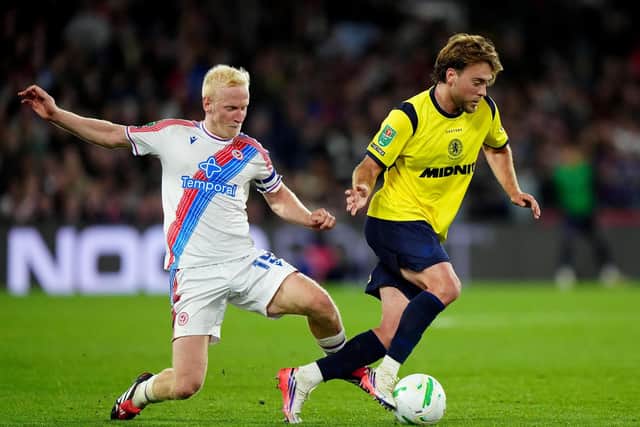 Crystal Palace's Will Hughes (left) and Middlesbrough's Aidan Morris battle for the ball during the Carabao Cup third round match at Selhurst Park.
