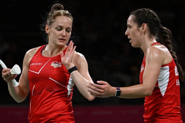 Silver lining: England's Chloe Birch, right, and Lauren Smith react against Malaysia's Koon Le Pearly Tan and Malaysia's Muralitharan Thinaah in their women's doubles gold medal badminton match on day eleven of the Commonwealth Games at the NEC arena in Birmingham (Picture: BEN STANSALL/AFP via Getty Images)