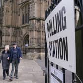 People leave after casting their vote at the polling station in Bridlington Priory Church, Yorkshire