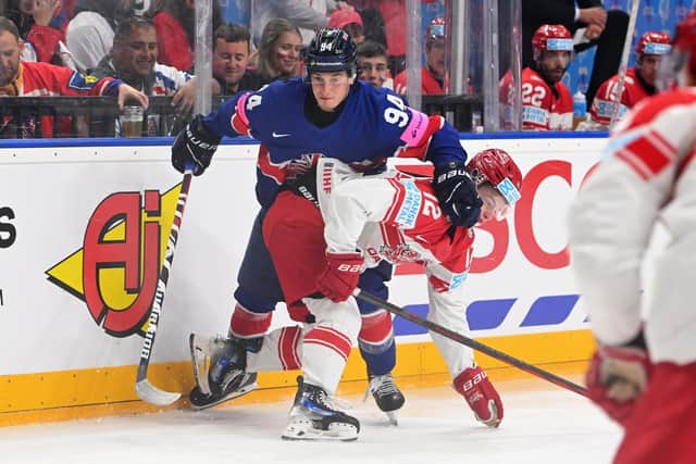 BATTLE STATIONS: Great Britain's Cade Neilson battles for possession with Denmark's Oscar Moelgaard during yesterday's Group A encounter at Prague Arena. Picture: Dean Woolley.