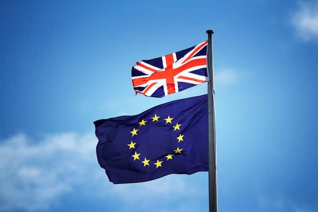 File photo of the Union Jack and the EU flag flying from the same mast. PIC: PA Wire/PA Images