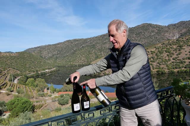 Adrian Bridge, CEO of Taylor Fladgate sets up a port tasting by the Douro. © Christine Austin