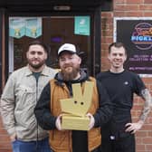 Head of people, Simon Barnes (centre) with Jack Charlesworth (left) and JB (right) at Slap & Pickle in Sheffield, as the restaurant is announced as the winner of Independent Restaurant of the Year North of England and East Midlands 2024 in Deliveroo's 2024 Restaurant Awards.