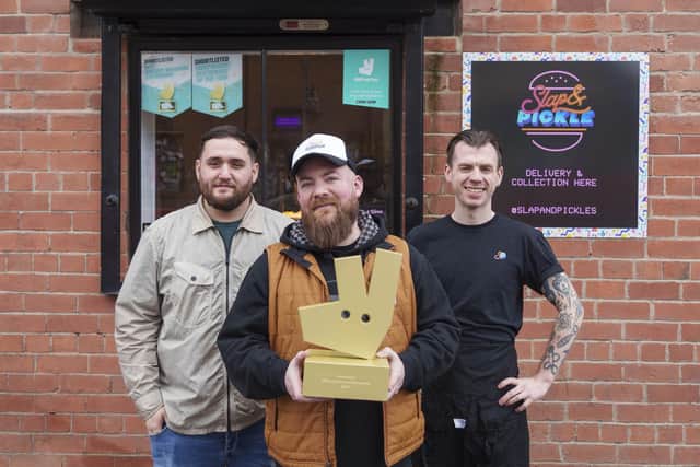 Head of people, Simon Barnes (centre) with Jack Charlesworth (left) and JB (right) at Slap & Pickle in Sheffield, as the restaurant is announced as the winner of Independent Restaurant of the Year North of England and East Midlands 2024 in Deliveroo's 2024 Restaurant Awards.