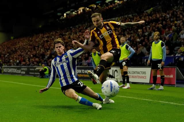 Sheffield Wednesday's Harry Gray and Bradford City's Macaulay Gillesphey battle for the ball during the Sky Bet League One match at Hillsborough Stadium, Sheffield. Picture date: Thursday August 20, 2026.