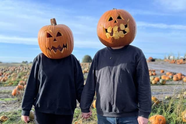 Couple dressed up as pumpkins. (Pic credit: Farmer Copleys)