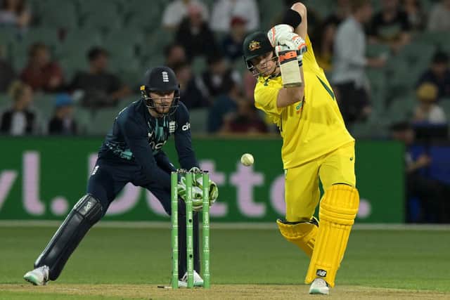 WINNING KNOCK: Australia's Steve Smith drives through the offside watched by England's Jos Buttler during the first one-day international in Adelaide. Picture: BRENTON EDWARDS/AFP via Getty Images