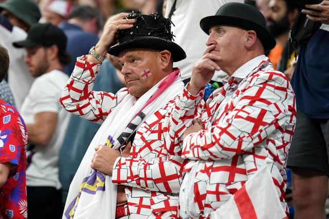 England fans appear dejected in the stands after the FIFA World Cup Group B match at the Al Bayt Stadium in Al Khor, Qatar. Picture: Mike Egerton/PA Wire.