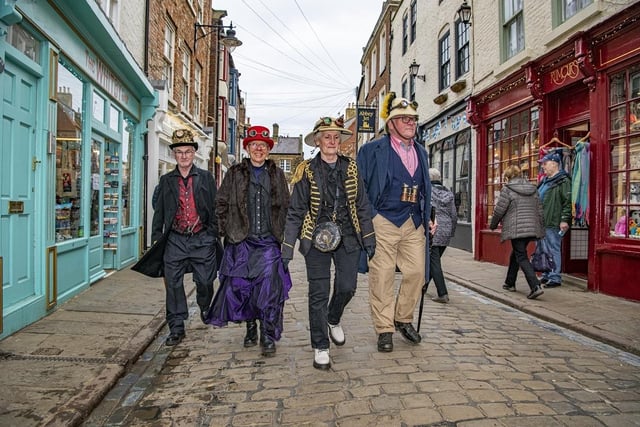 Mal Grassam, Phyllis Lampard, Gill Grassam and Stan Lampard walking through the town of Whitby during the Steampunk Weekend event.
