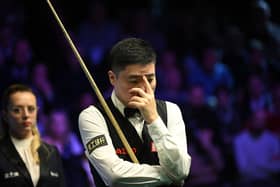 Scared to look: China's Ding Junhui, who is based in Sheffield, is back in the top 16 in the world as he looks to build on his run to the UK Championship final in York last December, at the World Championships in Sheffield. (Picture: OLI SCARFF/AFP via Getty Images)